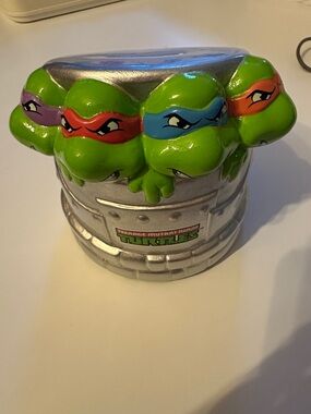 Teenage Mutant Ninja Turtles Green Piggy Bank with Colorful Masks